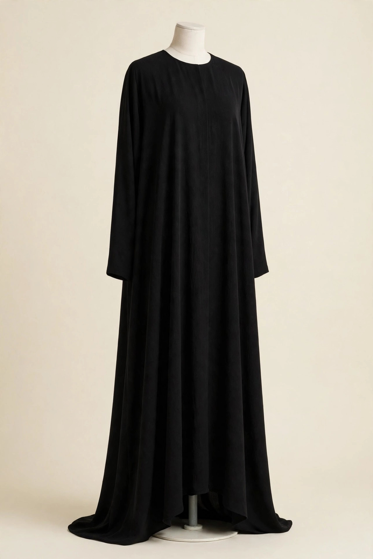 Classic black abaya styled with a sand chiffon hijab